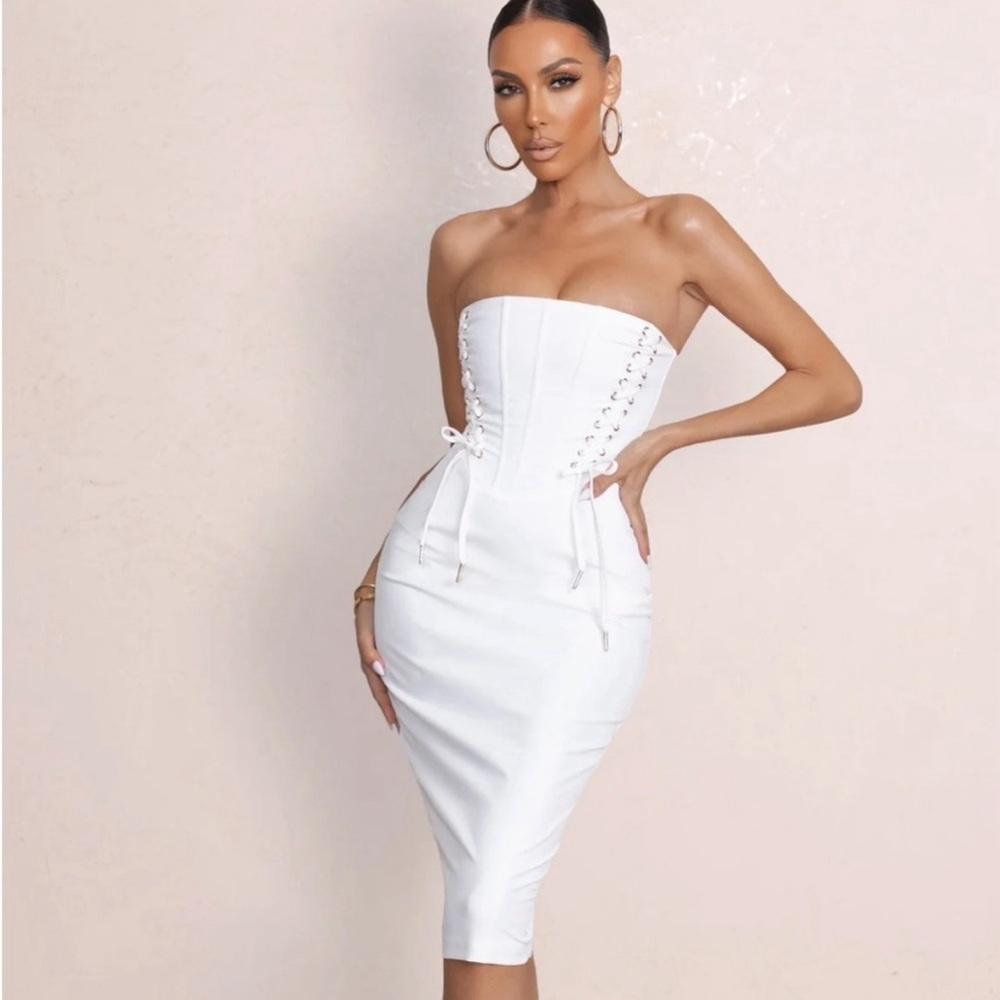Club L London white bandeau midi dress with lace up corset detail.